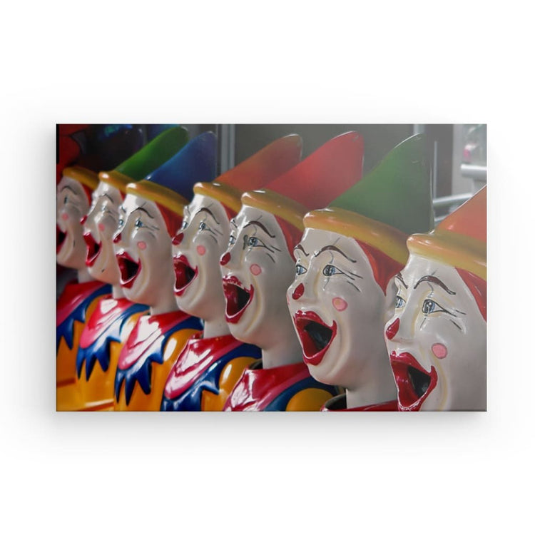 Step into a world of chilling beauty with "Carnival Nightmares." This captivating canvas print features a row of ceramic clowns, each with a colorful yet unsettling look. Add a touch of eerie intrigue to your space with this haunting artwork.
